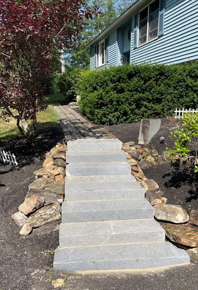 Princeton MA. Granite steps rebuild, aswell as removal and reset of the cobblestone walkway. Photo 1.
